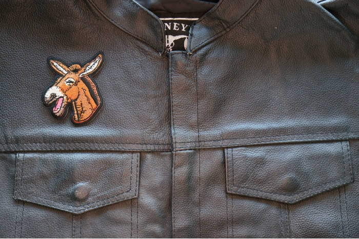 Laughing Donkey Iron on Patch shown on leather vest