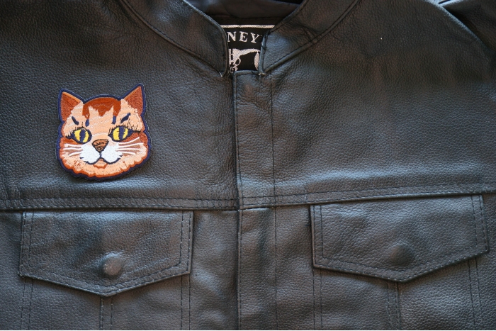 Mister Cat Iron on Patch shown on leather vest