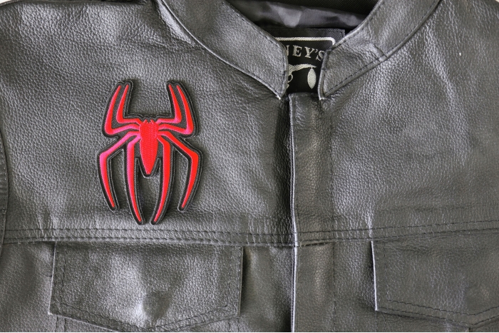 Red Spider Patch - 3x4 inch - Embroidered Iron on Patch shown on leather vest