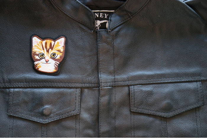 Sweet Kitty Cat Iron on Patch shown on leather vest