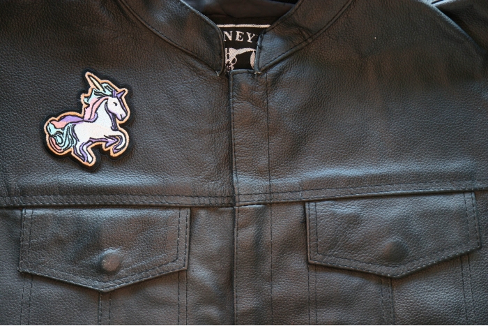 Unicorn Iron on Patch shown on leather vest