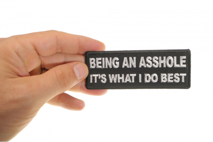Being An Asshole It's What I do Best Patch shown on hand for size comparison