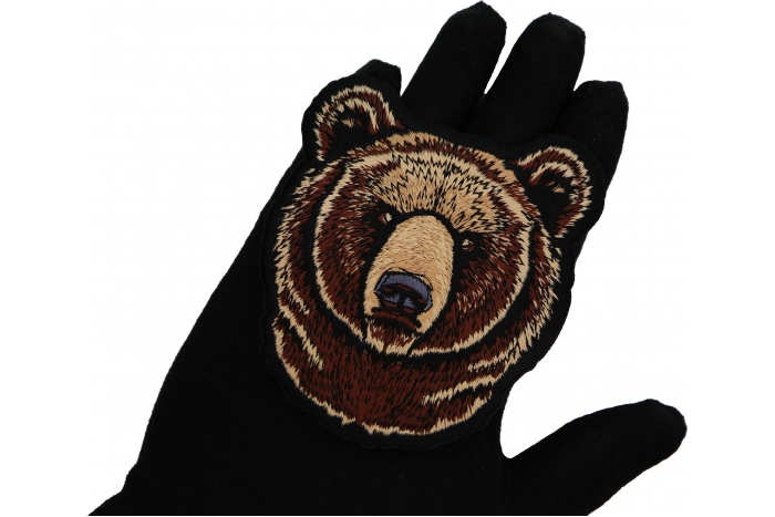 Bear Head Patch shown on hand for size comparison