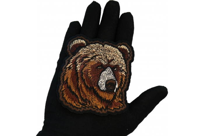 Bear Patch shown on hand for size comparison