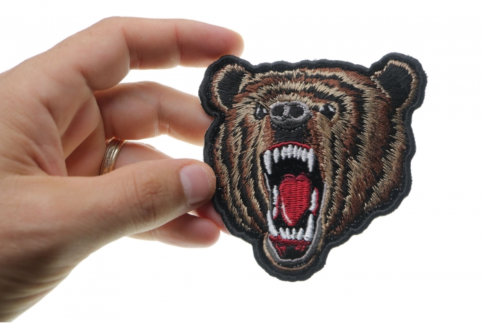 Bear Iron on Patch shown on hand for size comparison