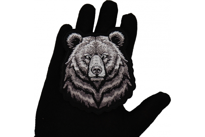 Bear Stare Patch shown on hand for size comparison
