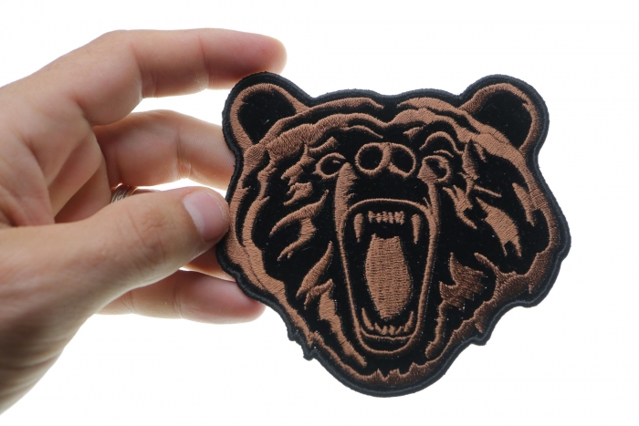 Brown Bear Iron on Patch Small shown on hand for size comparison