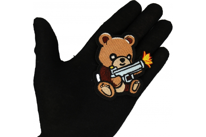 Cute Bear Machine Gun Patch shown on hand for size comparison