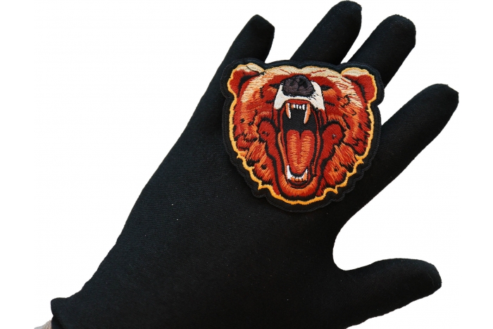 Iron on Bear Patch shown on hand for size comparison