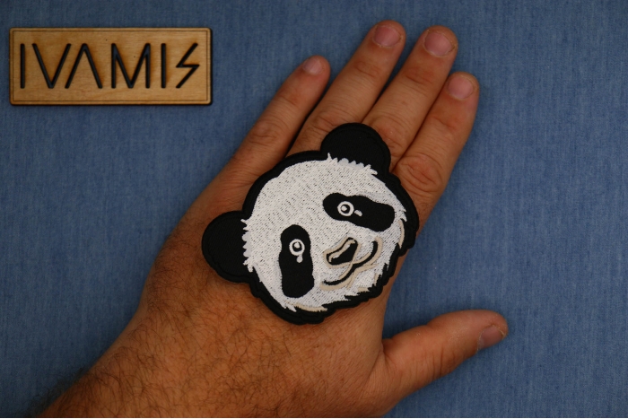 Panda Bear Patch shown on hand for size comparison