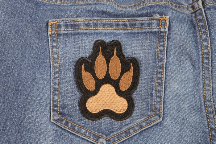 Canine Paw Print Iron on Patch shown on jeans