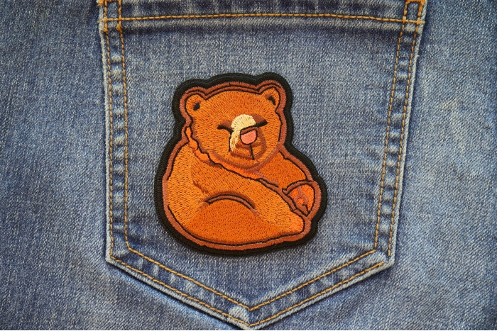 Funny Bear Iron on Patch shown on jeans