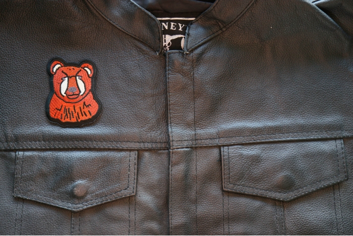 Cute Bear Iron on Patch shown on leather vest