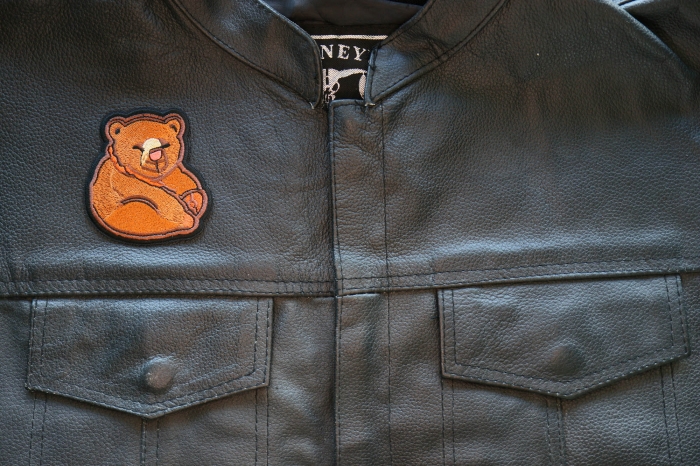 Funny Bear Iron on Patch shown on leather vest