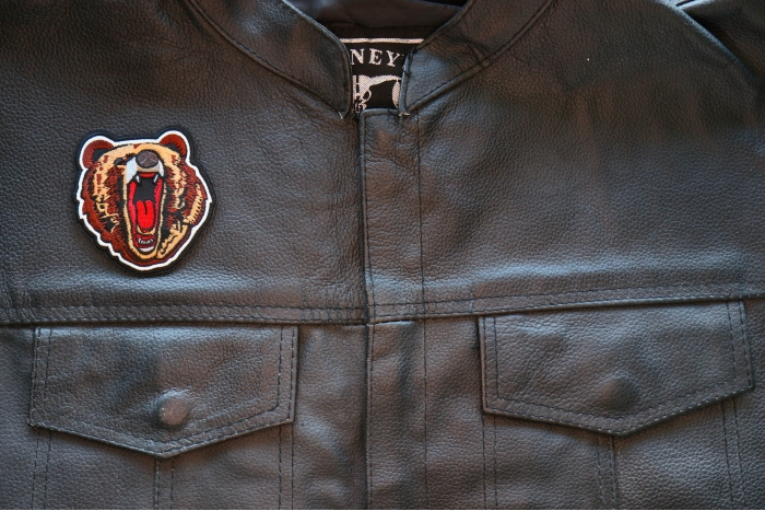 Yawning Bear Iron on Patch shown on leather vest