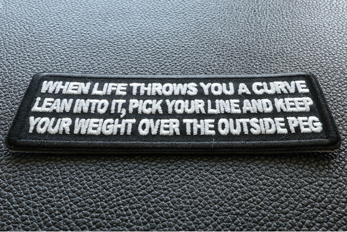 When Life throws you a curve, Lean into it, Pick your line and keep your weight over the outside Peg Patch diagonal view