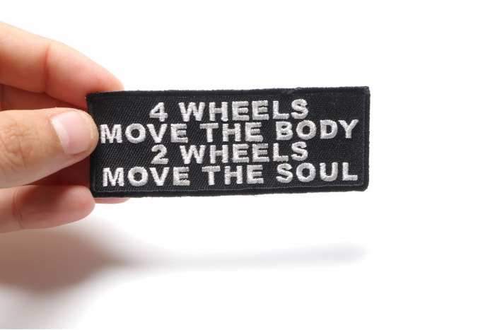 4 Wheels Move The Body 2 Wheels Move The Soul Patch, Biker Saying Patches shown on hand for size comparison