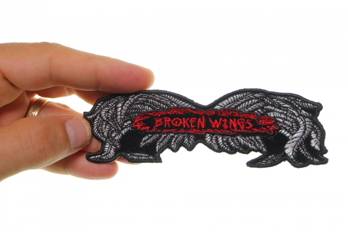 Broken Wings Small Biker Patch shown on hand for size comparison