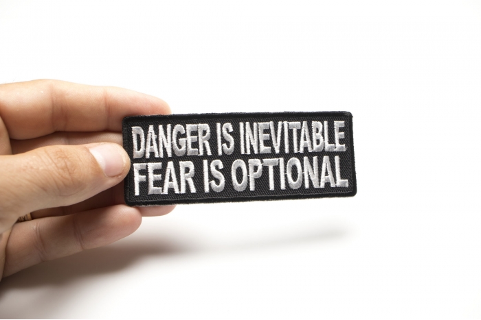 Danger Is Inevitable Fear Is Optional Patch, Biker Saying Patches shown on hand for size comparison