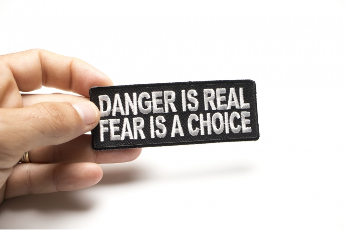 Danger Is Real Fear Is A Choice Patch, Biker Saying Patches shown on hand for size comparison