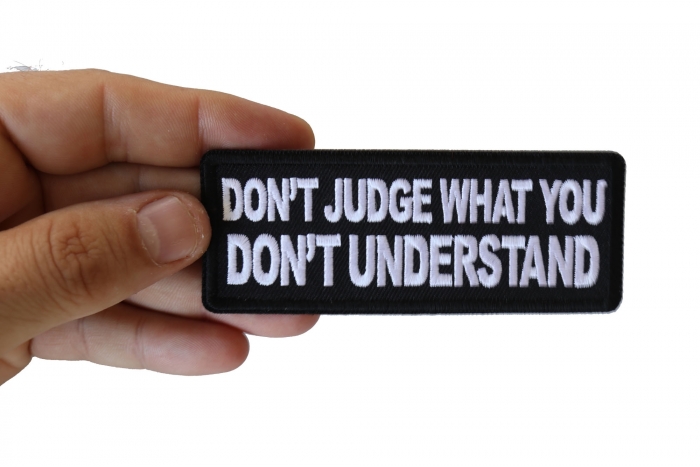 Don't Judge What You Don't Understand Patch, Biker Saying Patches shown on hand for size comparison