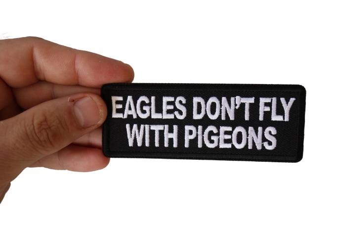 Eagles Don't Fly with Pigeons Patch, Biker Saying Patches shown on hand for size comparison