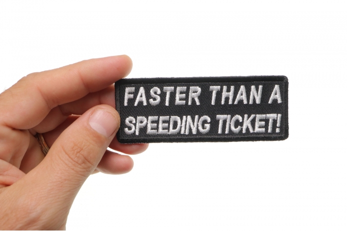 Faster Than A Speeding Ticket Patch, Biker Saying Patches shown on hand for size comparison