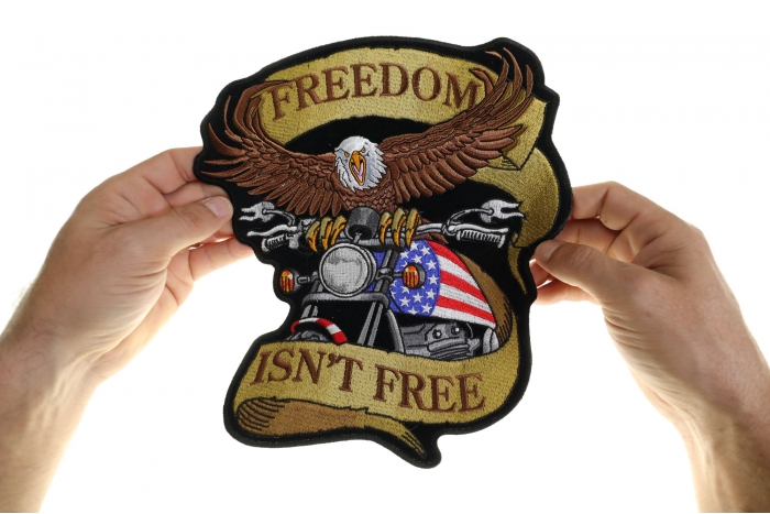 Eagle on Motorcycle Freedom Isn't Free Patch, Large Biker Back Patches for Leather Vests shown on hand for size comparison