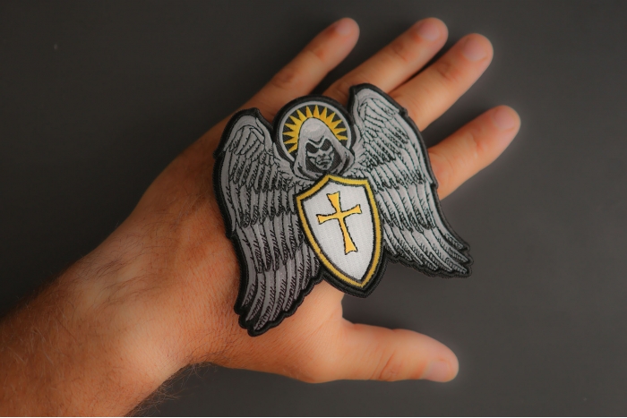 Guardian Angel Biker Patch shown on hand for size comparison