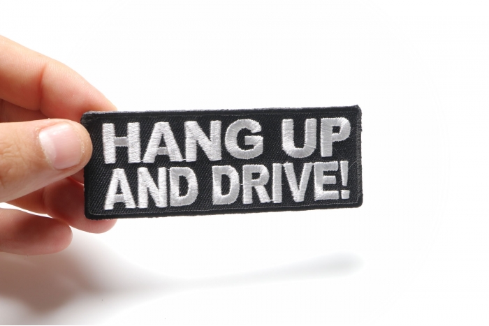 Hang Up and Drive Patch, Biker Saying Patches shown on hand for size comparison
