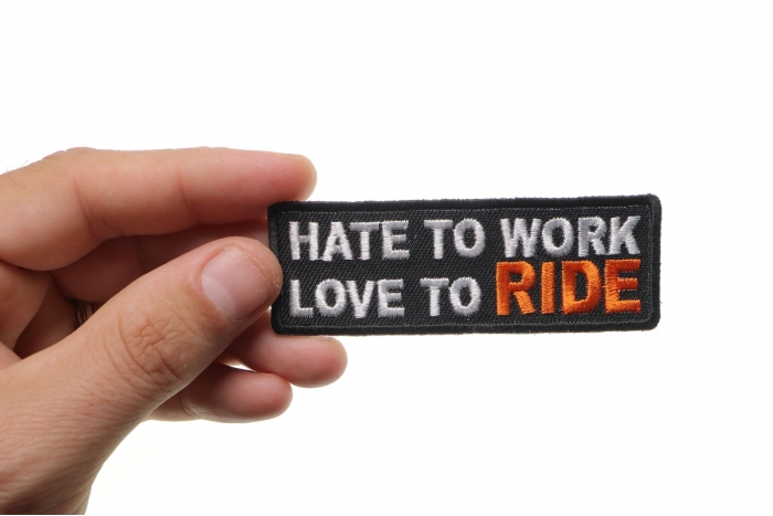Hate To Work Love To Ride Patch, Biker Saying Patches shown on hand for size comparison