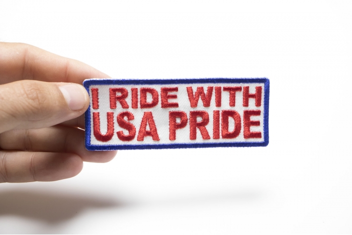 I Ride With USA Pride Patch, Biker Saying Patches shown on hand for size comparison