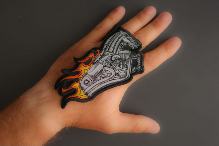Iron Horse Motorcycle with Flames Biker Patch shown on hand for size comparison