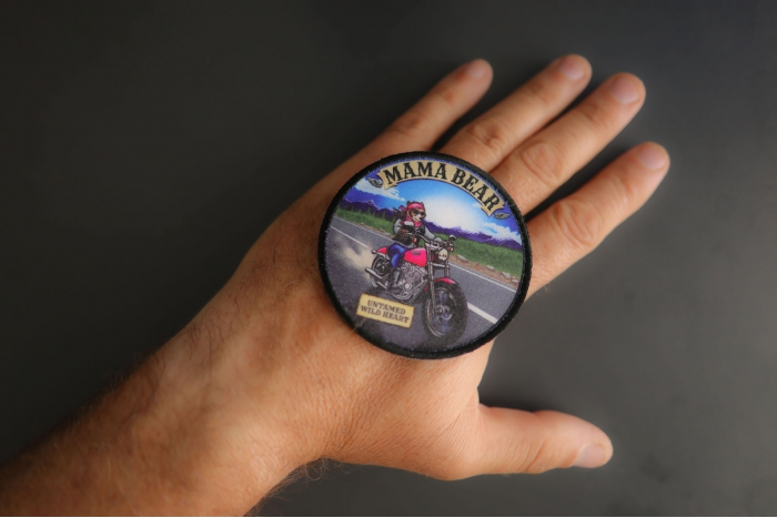 Mama Bear Patch shown on hand for size comparison