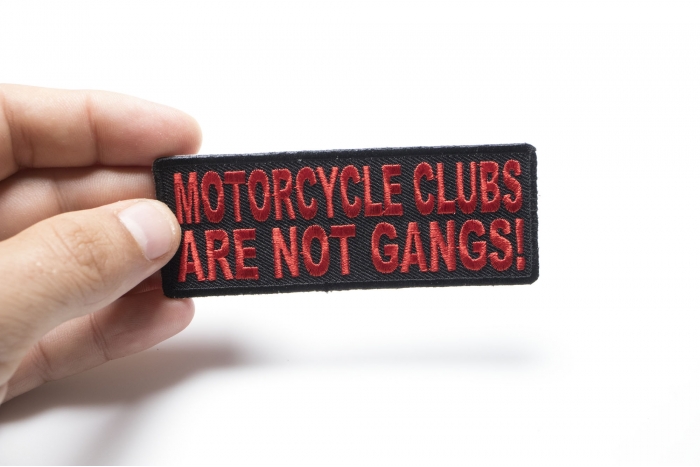 Motorcycle Clubs Are Not Gangs Patch, Biker Saying Patches shown on hand for size comparison