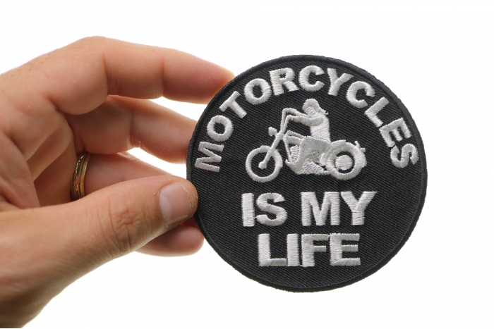 Motorcycles Is My Life Biker Saying Iron on Patch shown on hand for size comparison