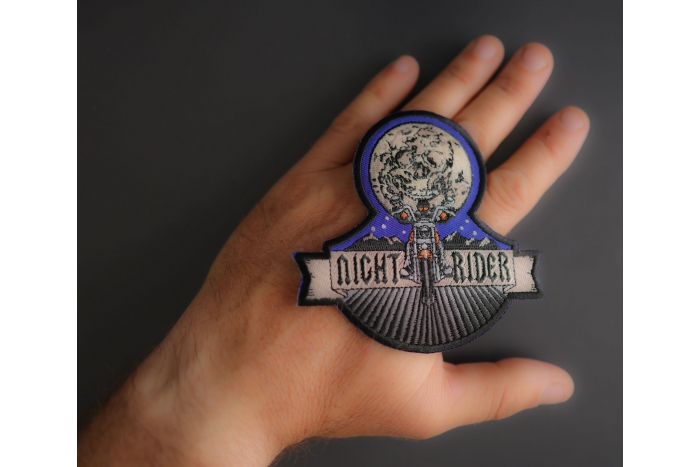 Night Rider Patch shown on hand for size comparison