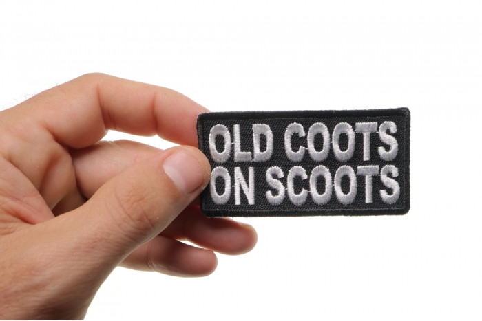 Old Coots On Scoots Patch shown on hand for size comparison