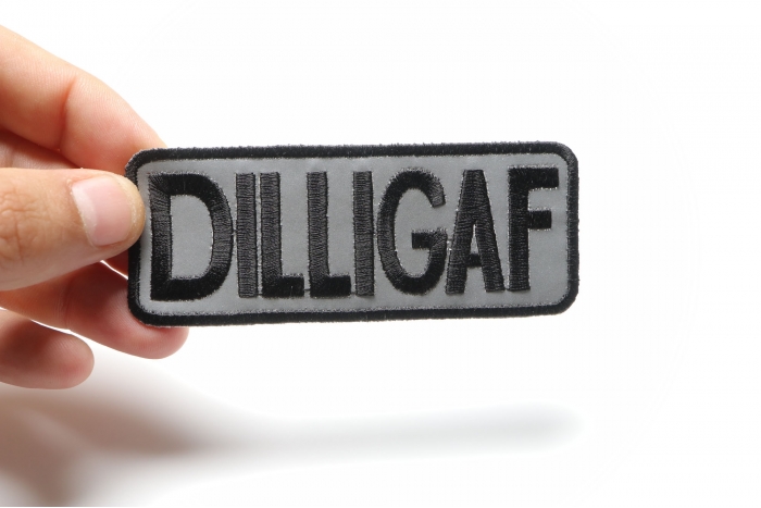 Reflective Dilligaf Patch, Biker Saying Patches shown on hand for size comparison