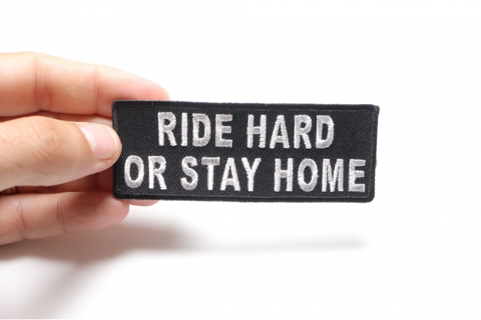 Ride Hard or Stay Home Patch, Biker Saying Patches shown on hand for size comparison