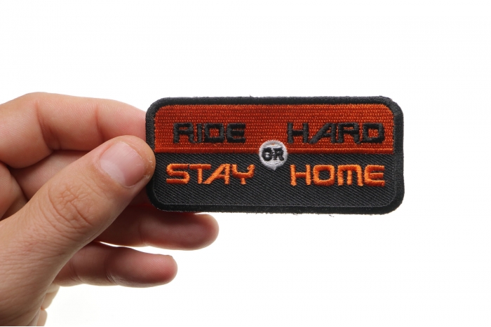 Ride Hard or Stay Home Patch, Biker Saying Patches shown on hand for size comparison