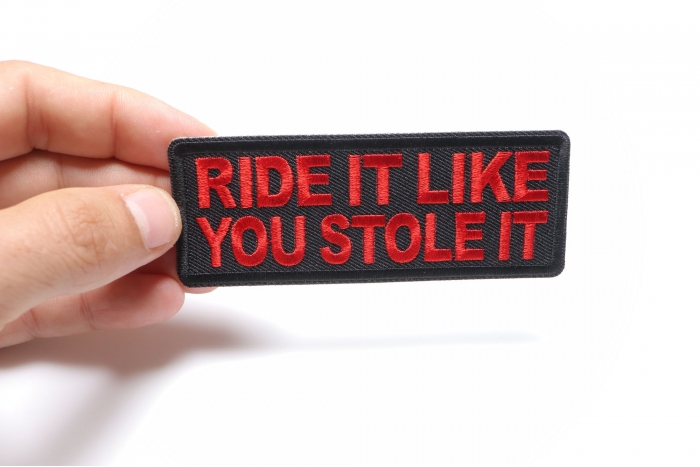 Ride it Like You Stole It Patch, Biker Saying Patches shown on hand for size comparison