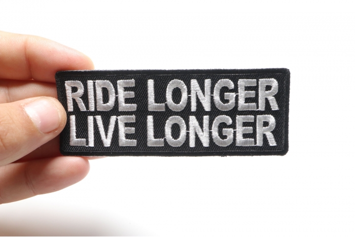 Ride Longer Live Longer Patch, Biker Saying Patches shown on hand for size comparison