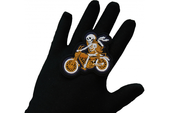 Skeleton Biker on Motorcycle Patch, Biker Skull Patches shown on hand for size comparison