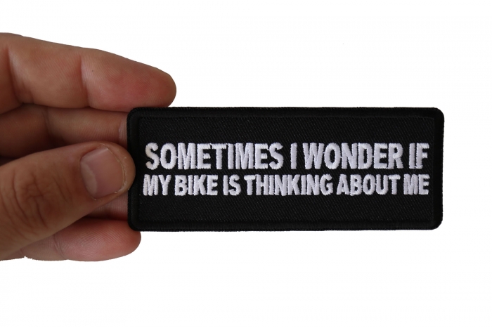 Sometimes I wonder if My Bike is Thinking About Me Patch, Biker Saying Patches shown on hand for size comparison
