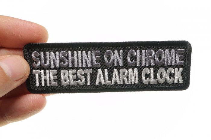 Sunshine On Chrome The Best Alarm Clock Patch, Biker Saying Patches shown on hand for size comparison