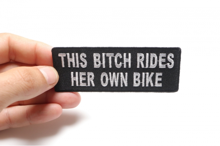 This Bitch Rides Her Own Bike Patch, Biker Saying Patches shown on hand for size comparison