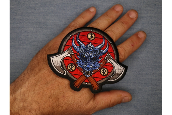 Viking Dragon and Axes Patch shown on hand for size comparison