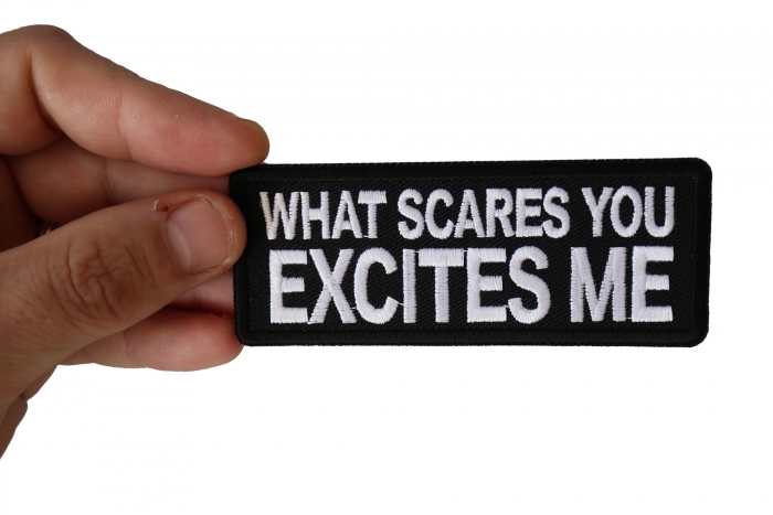 What Scares you Excites Me Patch, Biker Saying Patches shown on hand for size comparison