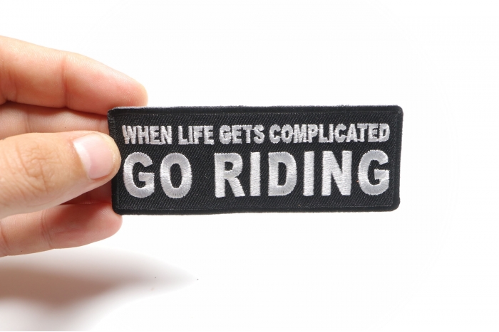 When Life Gets Complicated GO RIDING Patch, Biker Saying Patches shown on hand for size comparison